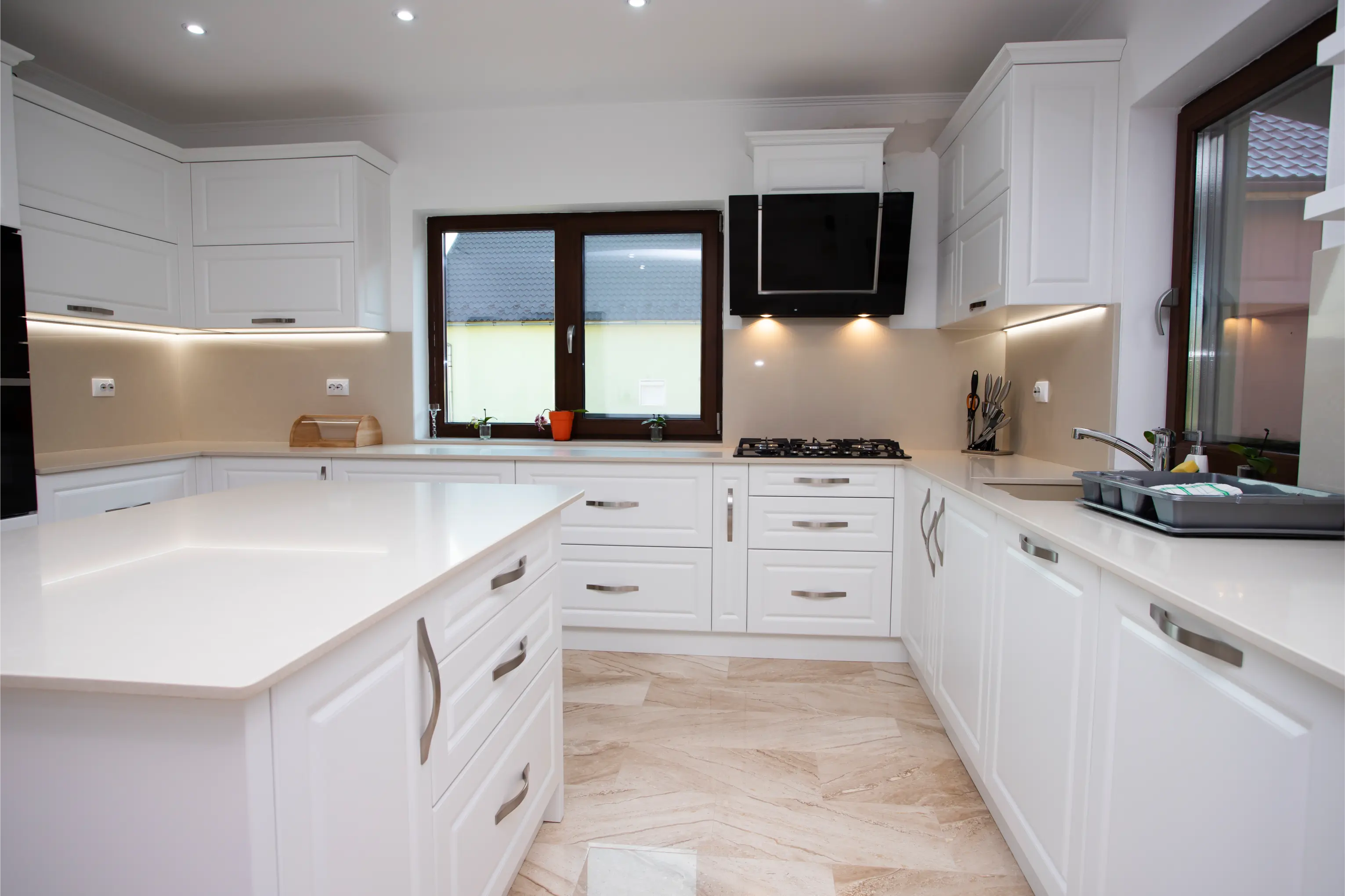 A finished white fitted kitchen after a full property refurbishment